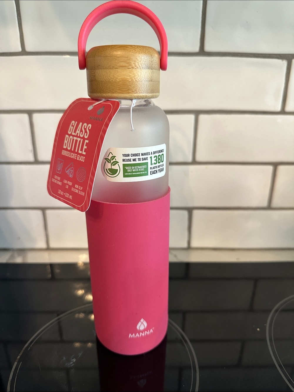 Manna Frosted Glass Bottle with Pink sleeve and bamboo lid 18oz